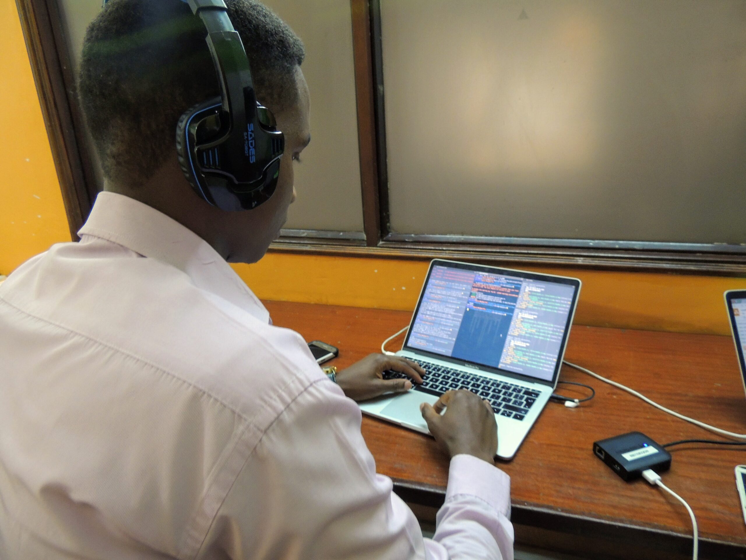Software developer working on a mobile app project at a computer