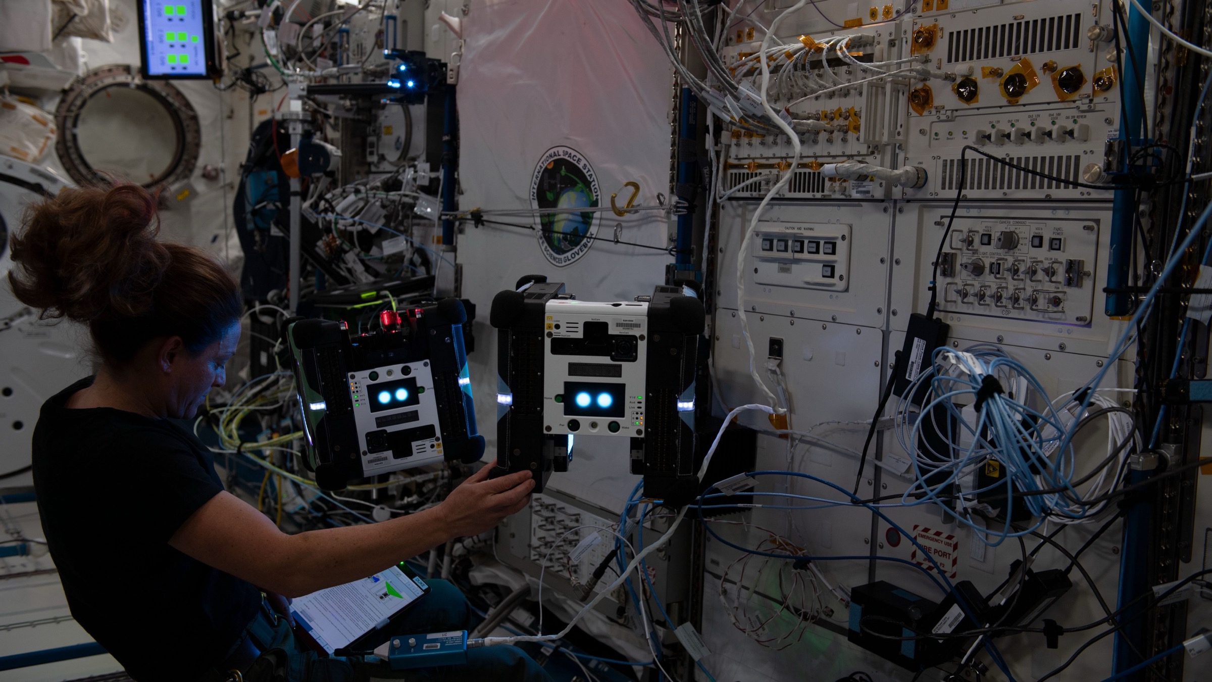 NASA astronaut testing smartphone vision guidance sensors with robotic systems