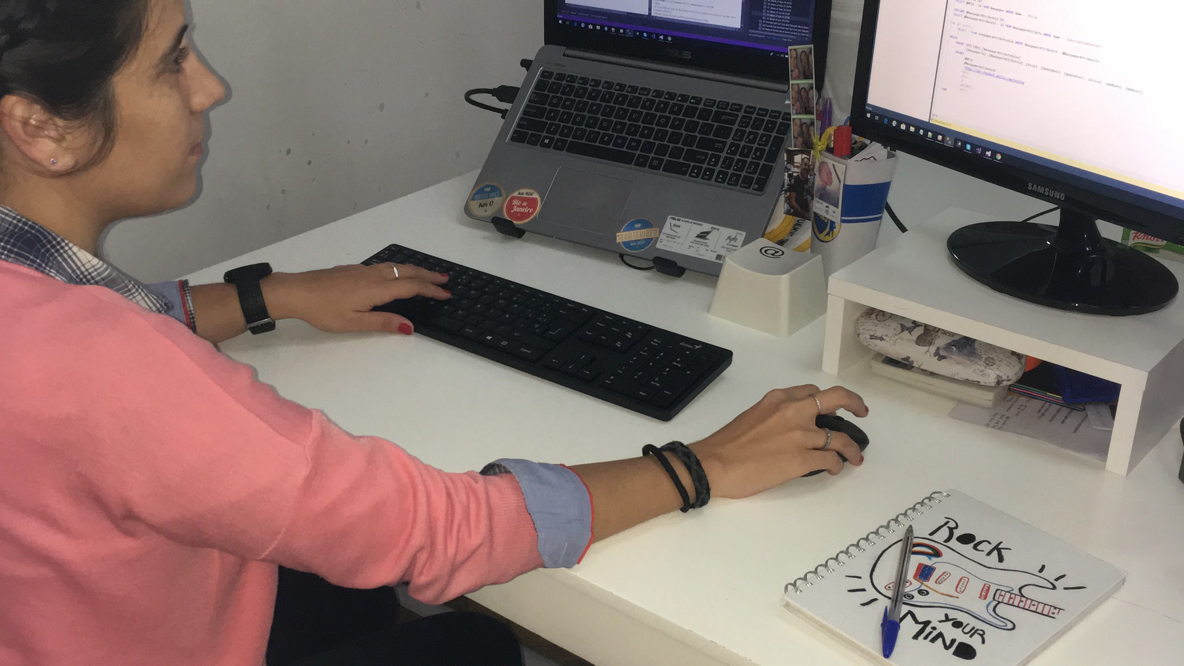Software engineer developing application code at a workstation