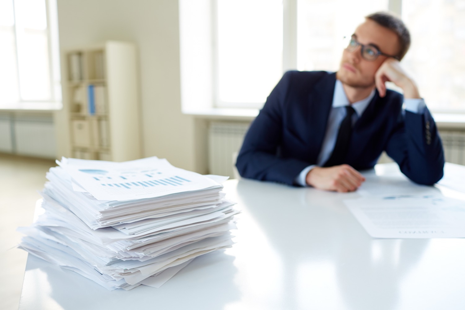 Stack of administrative documents and paperwork on a table