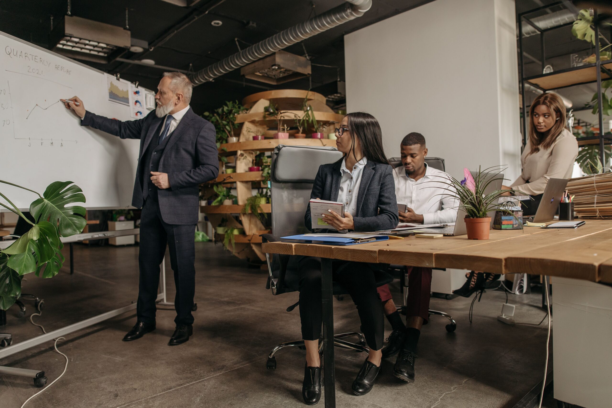 Business team reviewing AI governance controls during an office meeting
