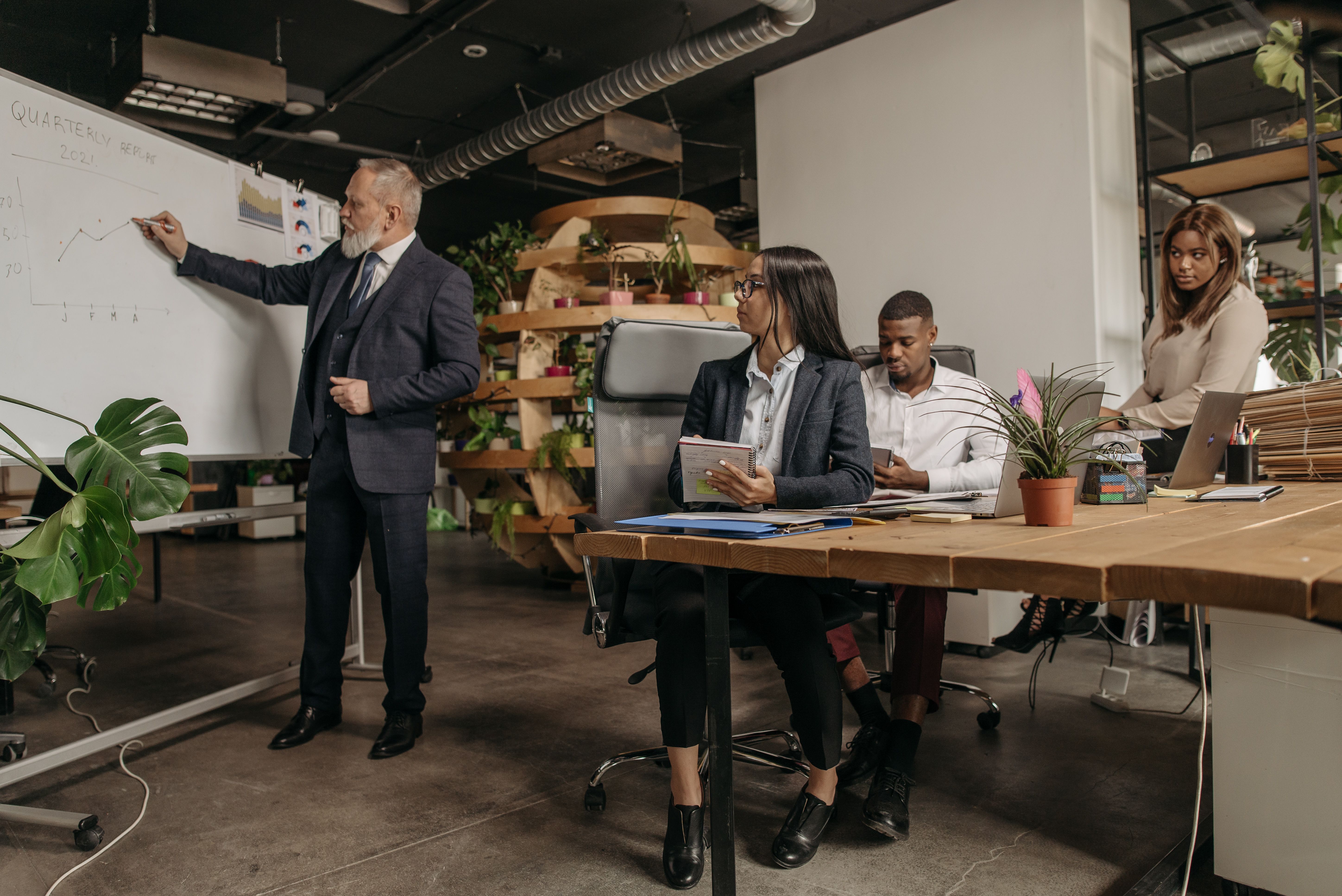 Business team reviewing AI governance controls during an office meeting