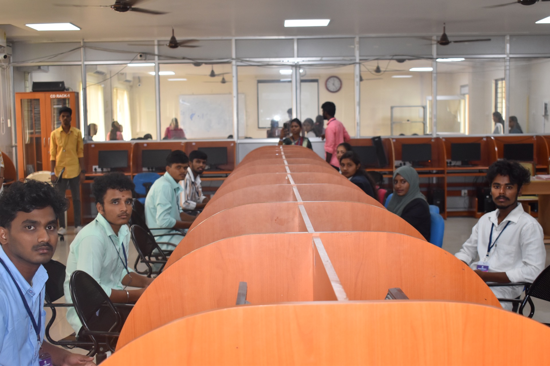 Technology workshop participants evaluating a presentation in a computer science classroom