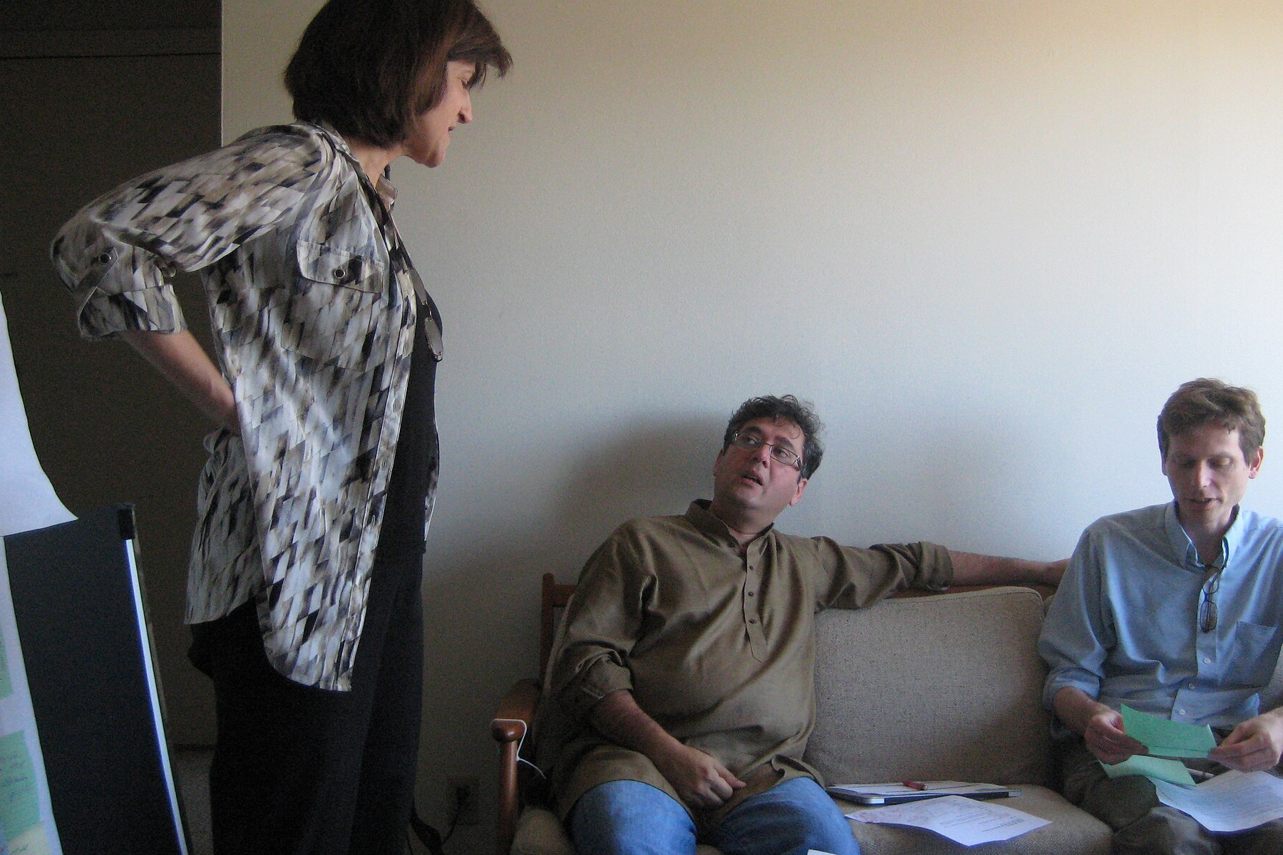 Software planning team reviewing notes during a requirements workshop