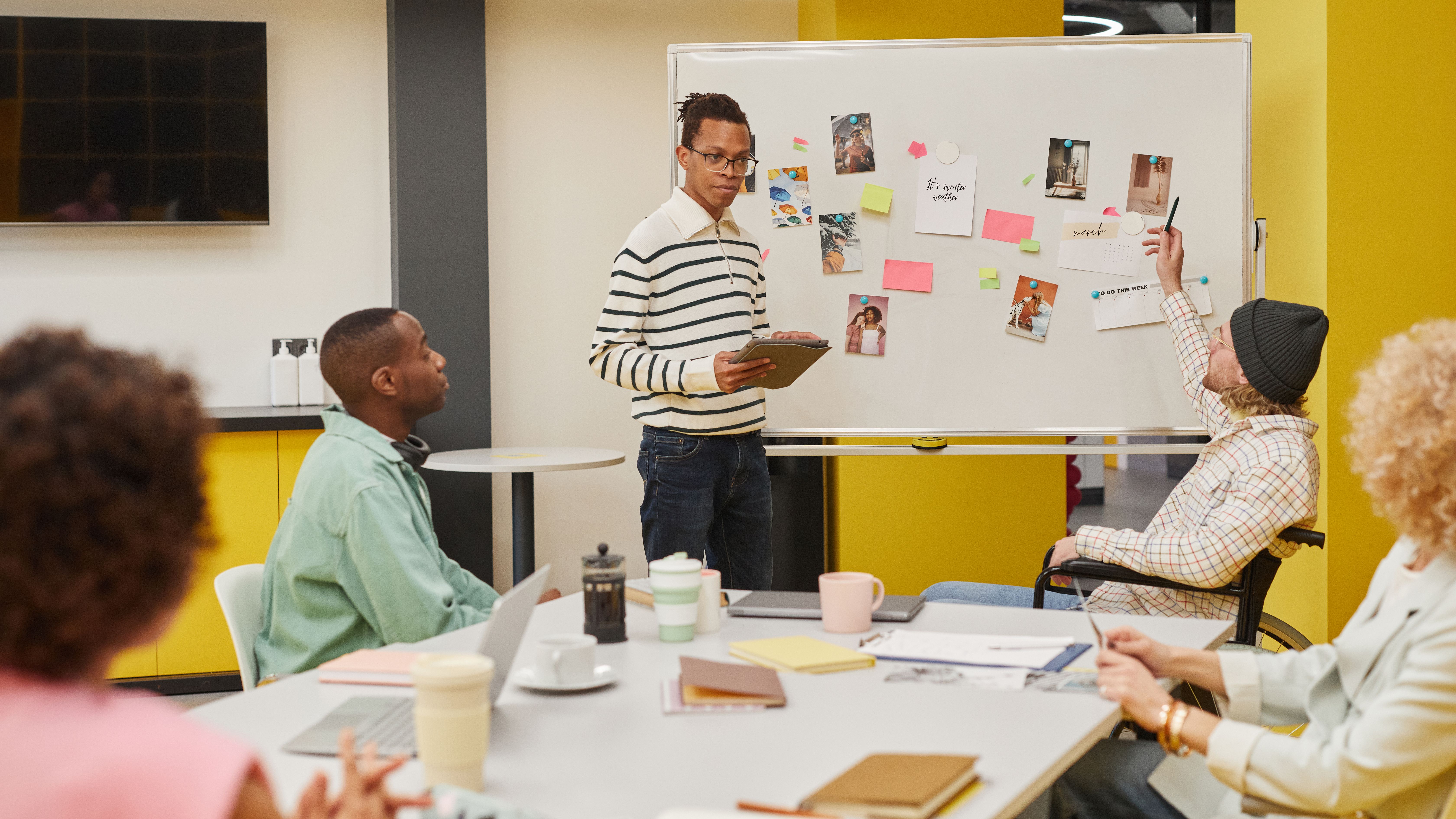 Team reviewing a custom software development RFP at a whiteboard